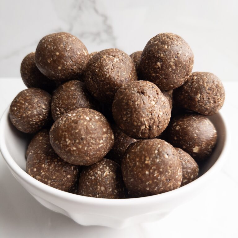 Chocolatey power balls sitting in a bowl