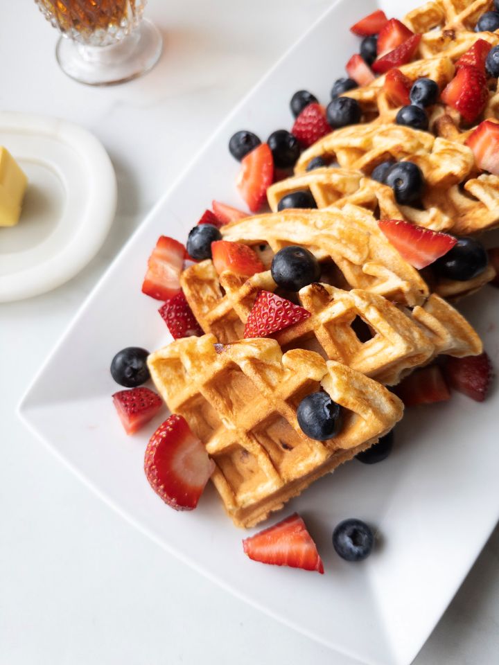 Fresh Milled Waffles with Greek Yogurt on a platter topped with berries