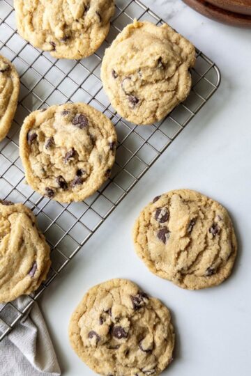 Fresh Milled Flour Chocolate Chip Cookies on a wire rack and on the counter