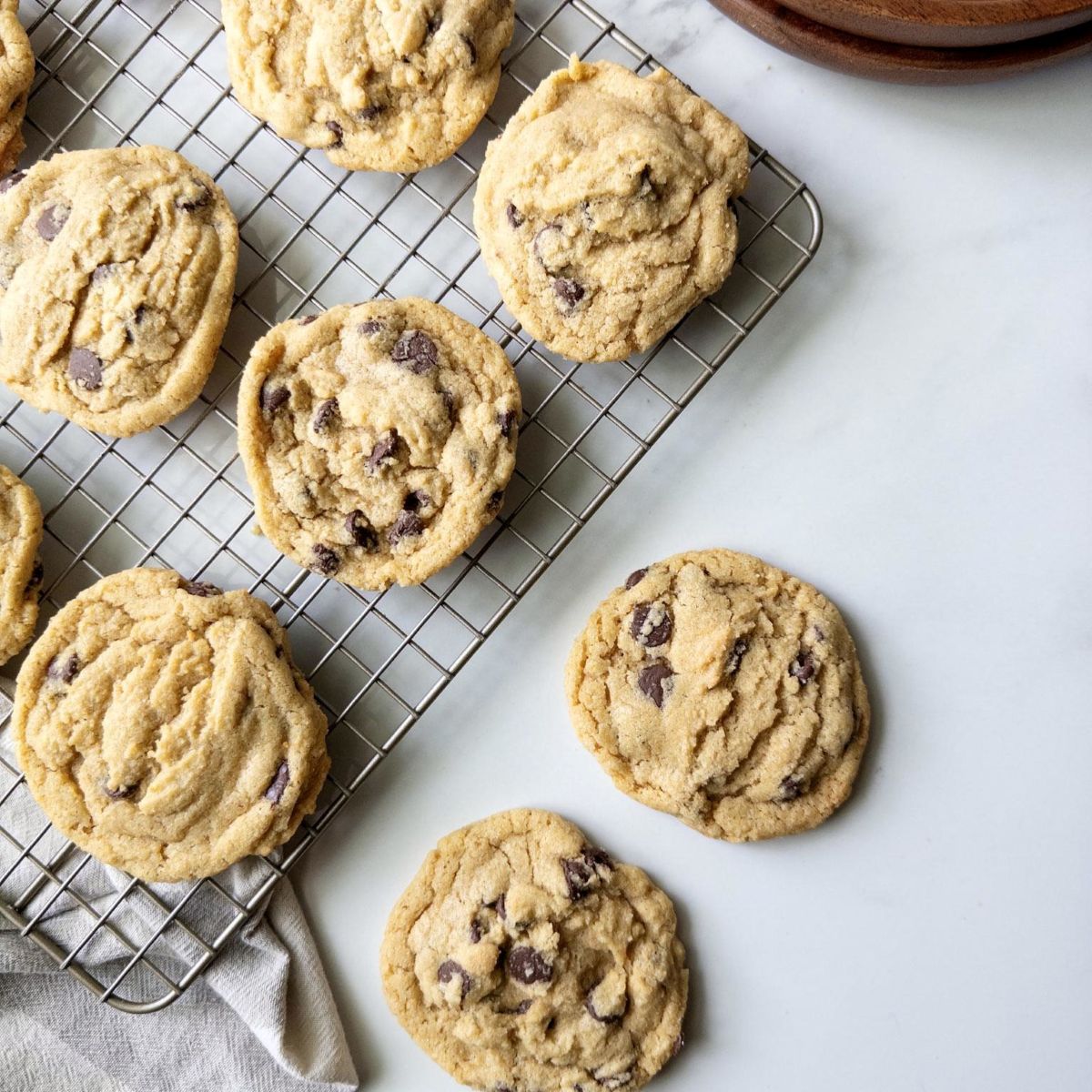 Fresh Milled Flour Chocolate Chip Cookies on a wire rack and on the counter