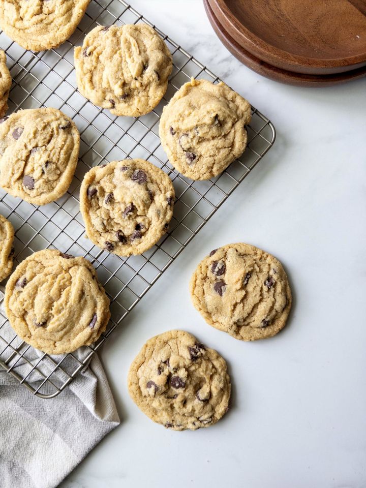 Fresh Milled Flour Chocolate Chip Cookies on a wire rack and on the counter