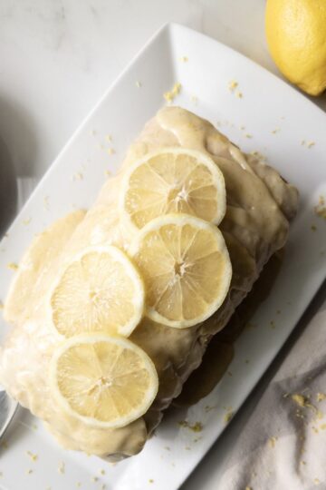 Fresh Milled Flour Lemon Loaf on a platter with lemon slices on top