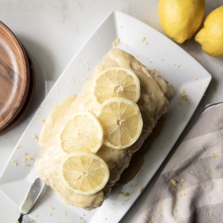Fresh Milled Flour Lemon Loaf on a platter with lemon slices on top