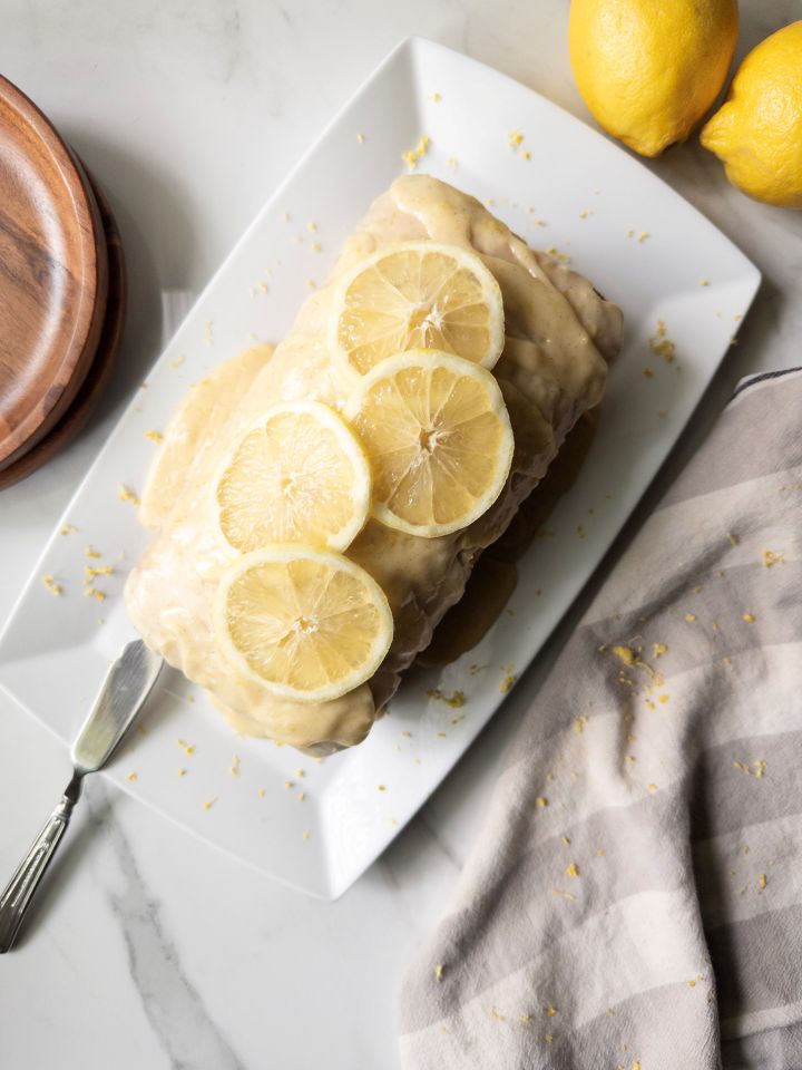 Fresh Milled Flour Lemon Loaf on a platter with lemon slices on top