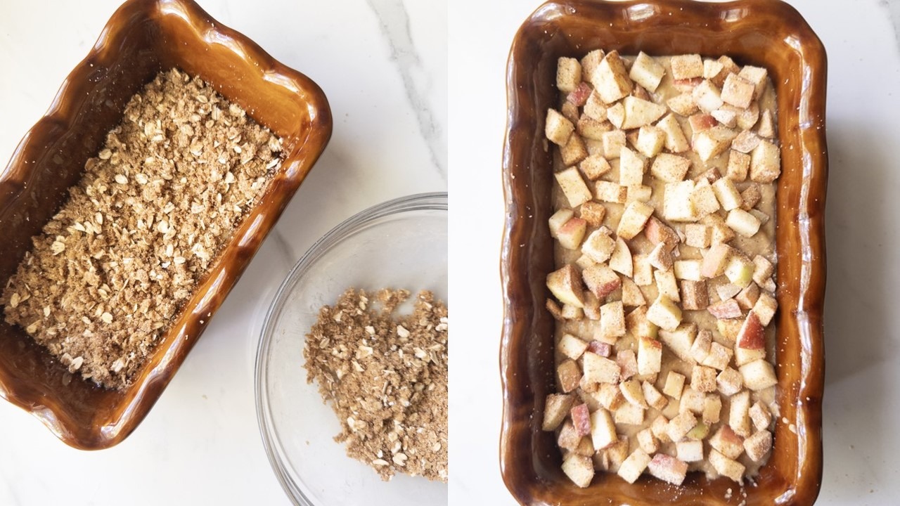 A loaf pan with a layer of oat crisp over the batter, with the rest of the crisp in a bowl, on the left and diced apples scattered over the batter on the right.
