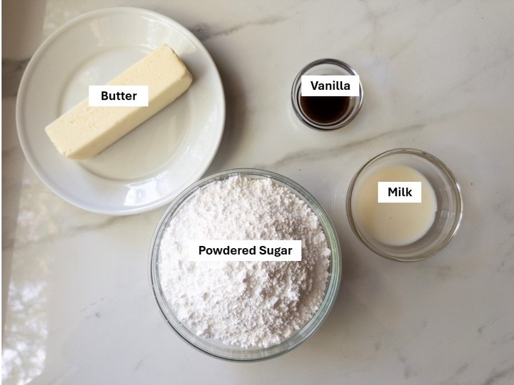 Labeled ingredients for buttercream frosting: butter, powdered sugar, vanilla, and milk.